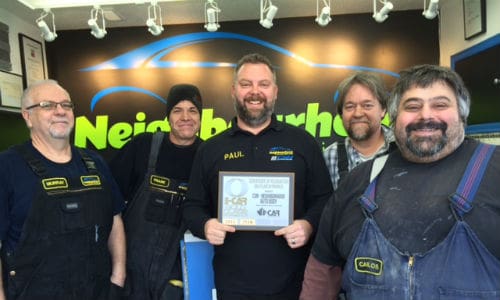 The team at CSN-Neighbourhood Auto Body proudly displays their I-CAR Gold Class certificate.